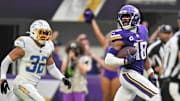 Minnesota Vikings wide receiver Justin Jefferson scores on a touchdown pass against Los Angeles Chargers safety Alohi Gilman