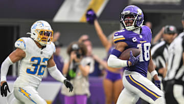 Minnesota Vikings wide receiver Justin Jefferson scores on a touchdown pass against Los Angeles Chargers safety Alohi Gilman
