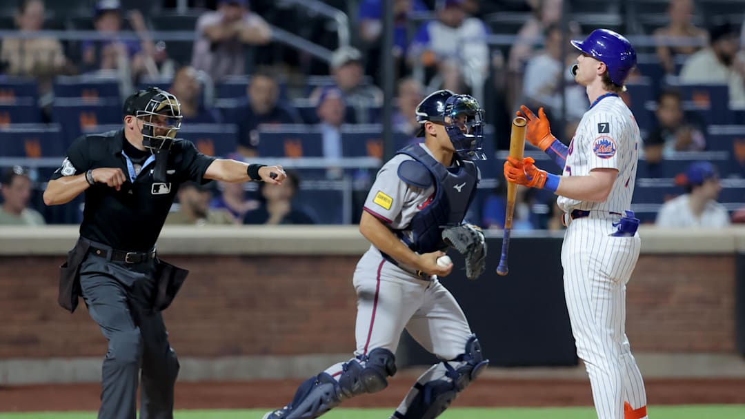 Jun 24, 2025; New York City, New York, USA; New York Mets third baseman Brett Baty (7) reacts as home plate umpire Adam Hamari (78) calls him out on strikes during the ninth inning against the Atlanta Braves at Citi Field. Mandatory Credit: Brad Penner-Imagn Images