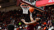 Feb 15, 2025; Blacksburg, Virginia, USA; Virginia Tech Hokies forward Tobi Lawal (1) goes up for a shot against the Virginia Cavaliers during the first half at Cassell Coliseum. Mandatory Credit: Brian Bishop-Imagn Images
