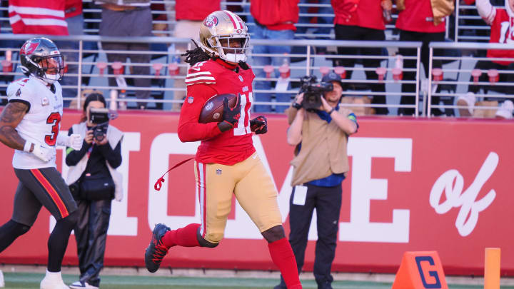 Nov 19, 2023; Santa Clara, California, USA; San Francisco 49ers wide receiver Brandon Aiyuk (11) runs after a catch for a 76-yard touchdown against the Tampa Bay Buccaneers during the third quarter at Levi's Stadium. Mandatory Credit: Kelley L Cox-USA TODAY Sports