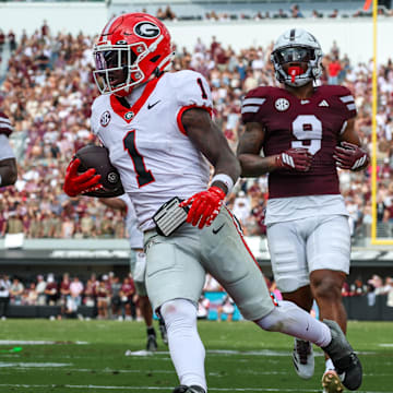 Nov 8, 2025; Starkville, Mississippi, USA; Georgia Bulldogs wide receiver Zachariah Branch (1) runs with the ball for a touchdown against the Mississippi State Bulldogs during the first half at Davis Wade Stadium at Scott Field. Mandatory Credit: Wesley Hale-Imagn Images