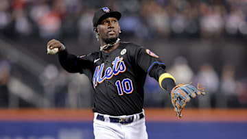 Sep 15, 2023; New York City, New York, USA; New York Mets third baseman Ronny Mauricio (10) throws a ball into the stands after the top of the first inning against the Cincinnati Reds at Citi Field. Mandatory Credit: Brad Penner-Imagn Images