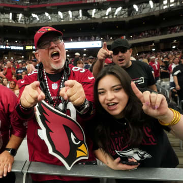 Arizona Cardinals fans cheer on their team during their 28-16 win against the Dallas Cowboys at State Farm Stadium in Glendale on Set. 24, 2023.