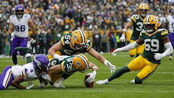 Nov 23, 2025; Green Bay, Wisconsin, USA; Green Bay Packers safety Zayne Anderson (39) recovers a muffed punt by Minnesota Vikings wide receiver Myles Price (4)  in the game at Lambeau Field. Mandatory Credit: Tork Mason-USA TODAY Network via Imagn Images