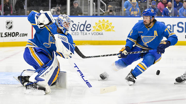 Jan 11, 2025; St. Louis, Missouri, USA;  St. Louis Blues goaltender Jordan Binnington (50) clears the puck out of the zone against the Columbus Blue Jackets during the first period at Enterprise Center. Mandatory Credit: Jeff Curry-Imagn Images