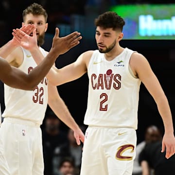 Dec 20, 2024; Cleveland, Ohio, USA; Cleveland Cavaliers guard Ty Jerome (2) celebrates with guard Donovan Mitchell (45) after hitting a three point basket during the first half against the Milwaukee Bucks at Rocket Mortgage FieldHouse. Mandatory Credit: Ken Blaze-Imagn Images