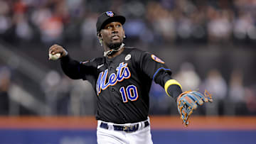Sep 15, 2023; New York City, New York, USA; New York Mets third baseman Ronny Mauricio (10) throws a ball into the stands after the top of the first inning against the Cincinnati Reds at Citi Field. Mandatory Credit: Brad Penner-Imagn Images