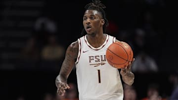 Mar 11, 2025; Charlotte, NC, USA;  Florida State Seminoles guard Jamir Watkins (1) brings the ball up court against the Syracuse Orange during the second half at Spectrum Center. Mandatory Credit: Jim Dedmon-Imagn Images