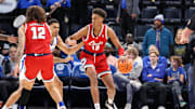 Feb 23, 2025; Memphis, Tennessee, USA; Florida Atlantic Owls forward Baba Miller (18) dribbles against Memphis Tigers forward Nicholas Jourdain (2) during the first half at FedExForum. Mandatory Credit: Wesley Hale-Imagn Images