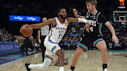 Nov 9, 2025; Memphis, Tennessee, USA; Oklahoma City Thunder guard Isaiah Joe (11) drives to the basket as Memphis Grizzlies guard Cam Spencer (24) defends during the second quarter at FedExForum. Mandatory Credit: Petre Thomas-Imagn Images