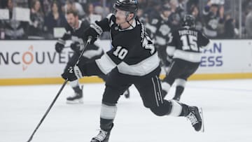 Mar 15, 2025; Los Angeles, California, USA; Los Angeles Kings left wing Tanner Jeannot (10) shoots the puck during warmups before a hockey game against the Nashville Predators at Crypto.com Arena. Mandatory Credit: Jessica Alcheh-Imagn Images