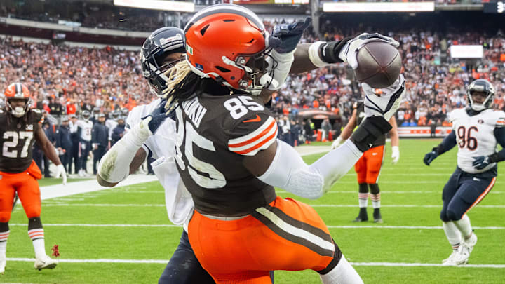 Dec 17, 2023; Cleveland, Ohio, USA; Cleveland Browns tight end David Njoku (85) catches a touchdown as Chicago Bears safety Jaquan Brisker (9) defends during the second quarter at Cleveland Browns Stadium.