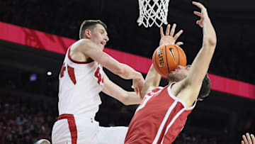 Jan 25, 2025; Fayetteville, Arkansas, USA; Arkansas Razorbacks forward Zvonimir Ivisic (44) blocks Oklahoma Sooners forward Sam Godwin (10) during the first half at Bud Walton Arena. Mandatory Credit: Nelson Chenault-Imagn Images
