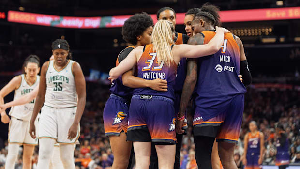 A photo of the Mercury huddling togethe