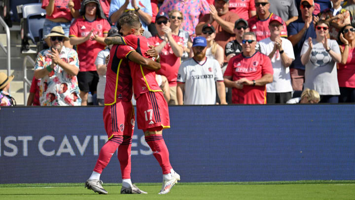 Sep 1, 2024; St. Louis, Missouri, USA; St. Louis CITY SC midfielder Marcel Hartel (17) celebrates with forward Jayden Reid (99) after scoring a goal against the LA Galaxy during the second half at CITYPARK. Mandatory Credit: Scott Rovak-USA TODAY Sports