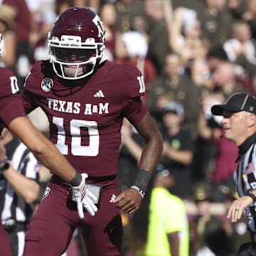Texas A&M quarterback Marcel Reed celebrates with wide receiver Izaiah Williams after an Aggies touchdown.