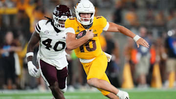 Arizona State quarterback Sam Leavitt (10) scrambles past Mississippi State Bulldogs linebacker Nic Mitchell (40) at Mountain America Stadium on Sept. 7, 2024, in Tempe.