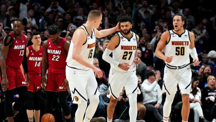 Denver Nuggets guard Jamal Murray (27) celebrates his basket with center Nikola Jokic (15) and forward Aaron Gordon (50) in the fourth quarter against the Miami Heat at Ball Arena. 