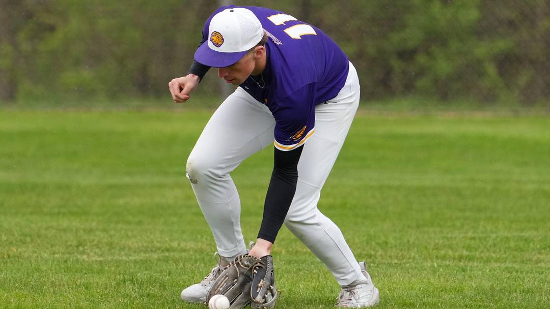 New Berlin Eisenhower right fielder Alex Michna (11) fields a ground ball versus Greendale in a Woodland Conference-West Division game on April 29, 2026 New Berlin Eisenhower right fielder Alex Michna (11) fields a ground ball versus Greendale in a Woodland Conference-West Division game on April 29, 2026