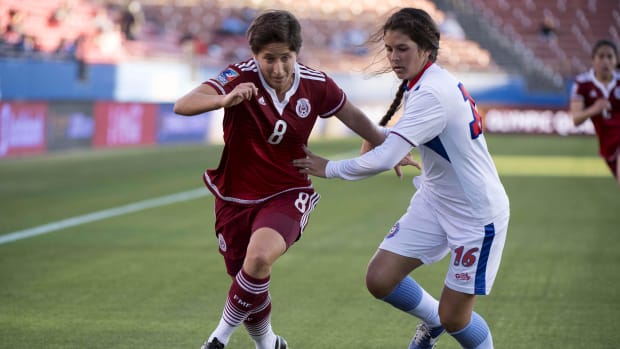 Mexico midfielder Teresa Noyola (8) and Puerto Rico defender Mirianee Zaragoza (16) chase the ball 