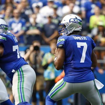 Sep 8, 2024; Seattle, Washington, USA; Seattle Seahawks quarterback Geno Smith (7) looks to pass against the Denver Broncos during the first quarter at Lumen Field. Mandatory Credit: Joe Nicholson-Imagn Images