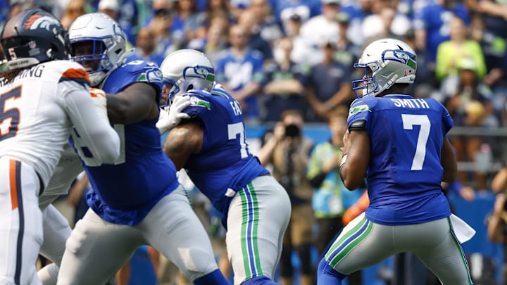 Sep 8, 2024; Seattle, Washington, USA; Seattle Seahawks quarterback Geno Smith (7) looks to pass against the Denver Broncos during the first quarter at Lumen Field. Mandatory Credit: Joe Nicholson-Imagn Images