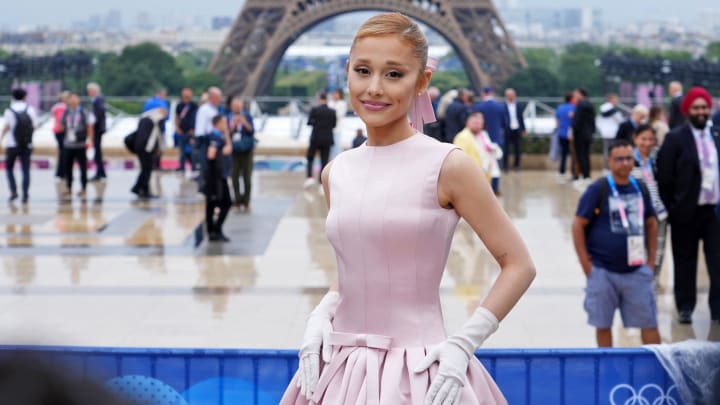 Jul 26, 2024: Ariana Grande poses for a photo in front of the Eiffel Tower before the Opening Ceremony for the Paris 2024 Olympic Summer Games.