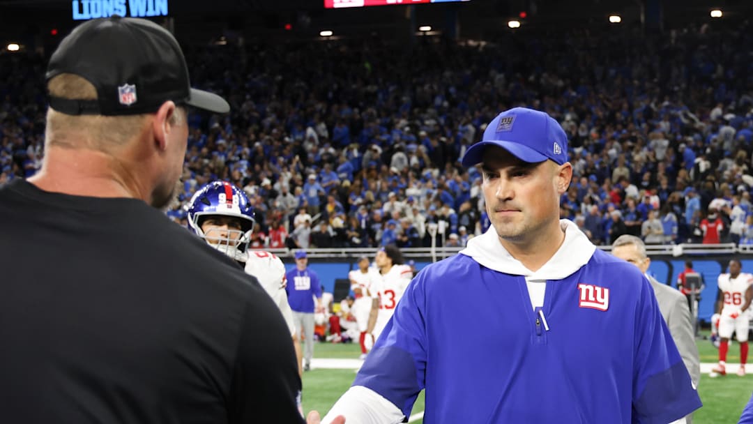 Former New York Giants head coach Mike Kafka shakes hands with Detroit Lions head coach Dan Campbell 