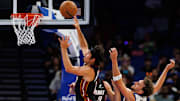 Oct 12, 2025; Orlando, Florida, USA; Miami Heat guard Jaime Jaquez Jr. (11) makes a layup over Orlando Magic forward Franz Wagner (22) during the first half at Kia Center. Mandatory Credit: Matt Pendleton-Imagn Images