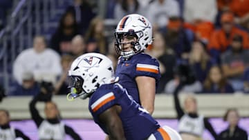 Nov 8, 2025; Charlottesville, Virginia, USA; Virginia Cavaliers quarterback Chandler Morris (4) looks on from the field against the Wake Forest Demon Deacons during the first half at Scott Stadium. Mandatory Credit: Amber Searls-Imagn Images