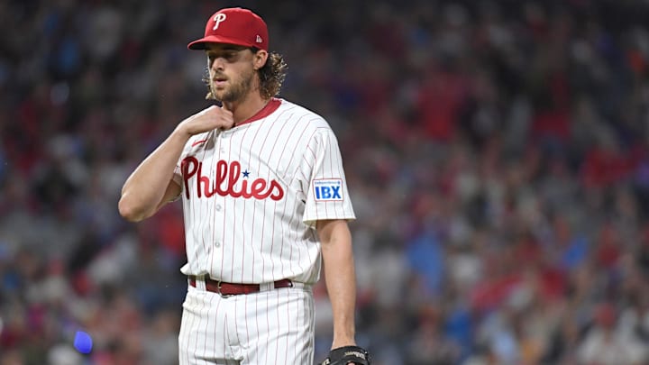 Sep 23, 2024; Philadelphia, Pennsylvania, USA; Philadelphia Phillies pitcher Aaron Nola (27) walks off the field after the fifth inning against the Chicago Cubs at Citizens Bank Park. Mandatory Credit: Eric Hartline-Imagn Images