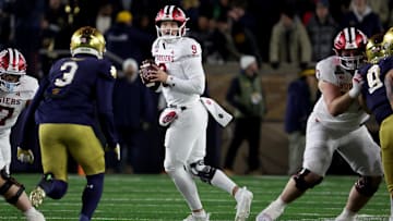 Dec 20, 2024; Notre Dame, Indiana, USA; Indiana Hoosiers quarterback Kurtis Rourke (9) drops to throw during the first half against the Notre Dame Fighting Irish at Notre Dame Stadium. Mandatory Credit: Trevor Ruszkowski-Imagn Images
