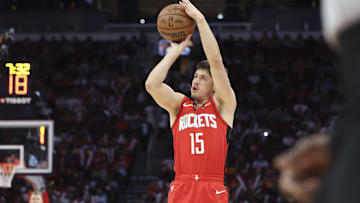 Apr 2, 2025; Houston, Texas, USA; Houston Rockets guard Reed Sheppard (15) shoots the ball during the fourth quarter against the Utah Jazz at Toyota Center. Mandatory Credit: Troy Taormina-Imagn Images