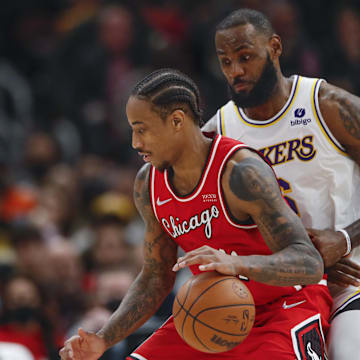 Dec 19, 2021; Chicago, Illinois, USA; Los Angeles Lakers forward LeBron James (6) defends against Chicago Bulls forward DeMar DeRozan (11) during the second half at United Center. Mandatory Credit: Kamil Krzaczynski-Imagn Images