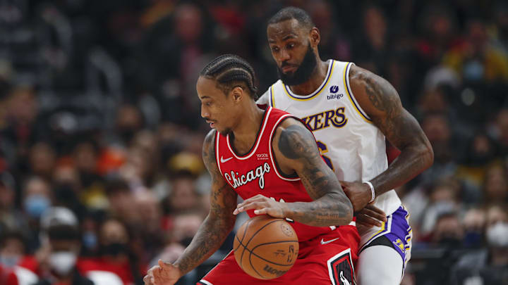 Dec 19, 2021; Chicago, Illinois, USA; Los Angeles Lakers forward LeBron James (6) defends against Chicago Bulls forward DeMar DeRozan (11) during the second half at United Center. Mandatory Credit: Kamil Krzaczynski-Imagn Images