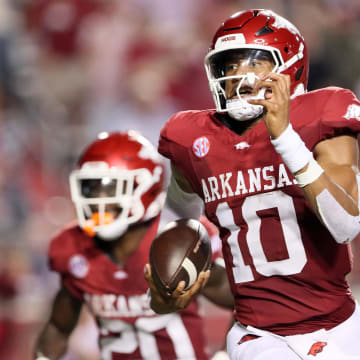 Aug 29, 2024; Little Rock, Arkansas, USA; Arkansas Razorbacks quarterback Taylen Green (10) rushes for a touchdown in the second quarter against the Pine Bluff Golden Lions at War Memorial Stadium. Mandatory Credit: Nelson Chenault-USA TODAY Sports