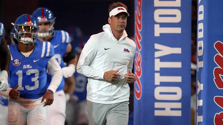 Nov 15, 2025; Oxford, Mississippi, USA; Mississippi Rebels head coach Lane Kiffin runs out of the tunnel prior to the game against the Florida Gators at Vaught-Hemingway Stadium. Mandatory Credit: Petre Thomas-Imagn Images