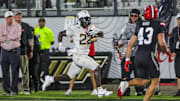 Aug 28, 2025; Orlando, Florida, USA; UCF Knights running back Myles Montgomery (22) runs the ball during the second quarter against the Jacksonville State Gamecocks at Acrisure Bounce House. Mandatory Credit: Mike Watters-Imagn Images