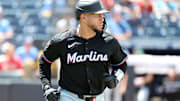 Jun 6, 2025; St. Petersburg, Florida, USA; Miami Marlins catcher Agustin Ramirez (50) singles against the Tampa Bay Rays during the eighth inning at George M. Steinbrenner Field. 