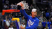 Mar 29, 2025; Newark, NJ, USA; Duke Blue Devils head coach Jon Scheyer cuts down the net after the Duke Blue Devils beat the Alabama Crimson Tide in the East Regional final of the 2025 NCAA tournament at Prudential Center. Mandatory Credit: Robert Deutsch-Imagn Images