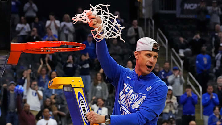 Mar 29, 2025; Newark, NJ, USA; Duke Blue Devils head coach Jon Scheyer cuts down the net after the Duke Blue Devils beat the Alabama Crimson Tide in the East Regional final of the 2025 NCAA tournament at Prudential Center. Mandatory Credit: Robert Deutsch-Imagn Images Mar 29, 2025; Newark, NJ, USA; Duke Blue Devils head coach Jon Scheyer cuts down the net after the Duke Blue Devils beat the Alabama Crimson Tide in the East Regional final of the 2025 NCAA tournament at Prudential Center. Mandatory Credit: Robert Deutsch-Imagn Images