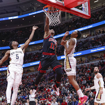 Nov 9, 2022; Chicago, Illinois, USA; Chicago Bulls forward DeMar DeRozan (11) goes up for a dunk against the New Orleans Pelicans during the first half at United Center. 