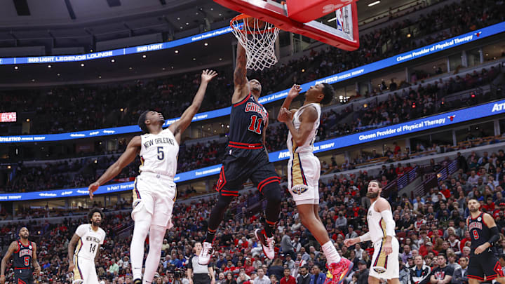 Nov 9, 2022; Chicago, Illinois, USA; Chicago Bulls forward DeMar DeRozan (11) goes up for a dunk against the New Orleans Pelicans during the first half at United Center. 