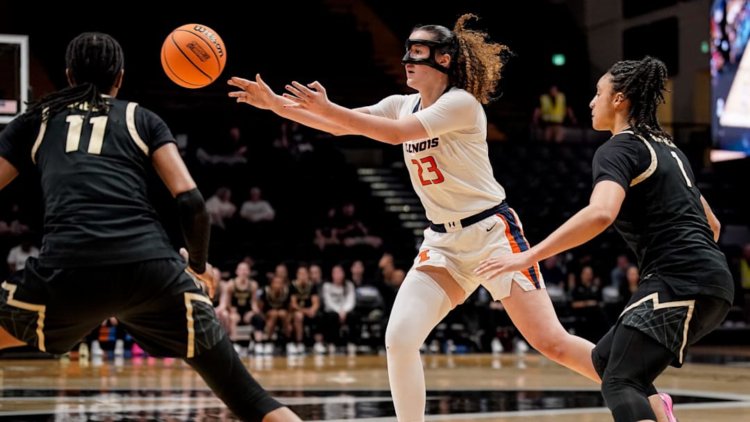Illinois forward Berry Wallace (23) passes the ball past Colorado forward Logyn Greer (11) during the second half in the first round of the NCAA college basketball tournament at Memorial Gym in Nashville, Tenn., Saturday, March 21, 2026.