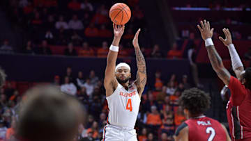 Nov 8, 2024; Champaign, Illinois, USA;  Illinois Fighting Illini guard Kylan Boswell (4) shoots the ball during the first half against the SIU Edwardsville Cougars at State Farm Center. Mandatory Credit: Ron Johnson-Imagn Images