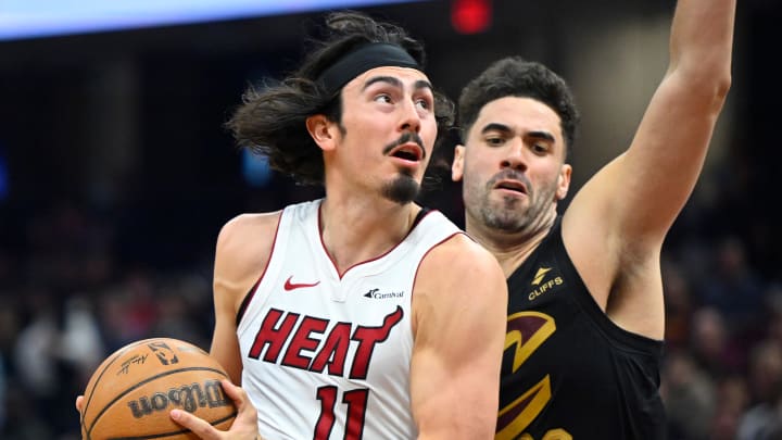 Mar 20, 2024; Cleveland, Ohio, USA; Miami Heat guard Jaime Jaquez Jr. (11) drives against Cleveland Cavaliers forward Georges Niang (20) in the second quarter at Rocket Mortgage FieldHouse. Mandatory Credit: David Richard-USA TODAY Sports