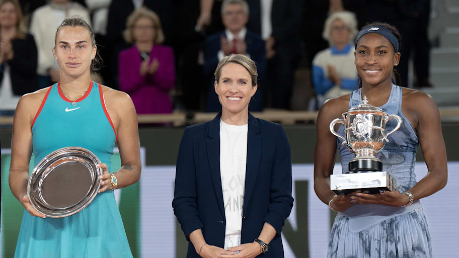 Coco Gauff of the United States poses with Aryna Sabalenka and Justin Henin after their match on day 14 at Roland Garros Stadium. | Susan Mullane-Imagn Images