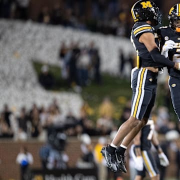 Nov 11, 2023; Columbia, Missouri, USA; Missouri Tigers players celebrate after a missed field goal by Tennessee at the end of the game at Faurot Field at Memorial Stadium. Mandatory Credit: Kylie Graham-Imagn Images