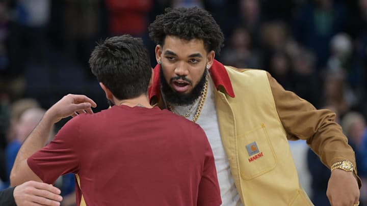 Cleveland Cavaliers guard Ricky Rubio (red shirt) and Minnesota Timberwolves center Karl-Anthony Towns (right) greet each after the game at Target Center on Jan. 14, 2023. Cleveland Cavaliers guard Ricky Rubio (red shirt) and Minnesota Timberwolves center Karl-Anthony Towns (right) greet each after the game at Target Center on Jan. 14, 2023.